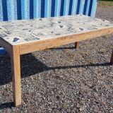 Teak dining table with illustrated top