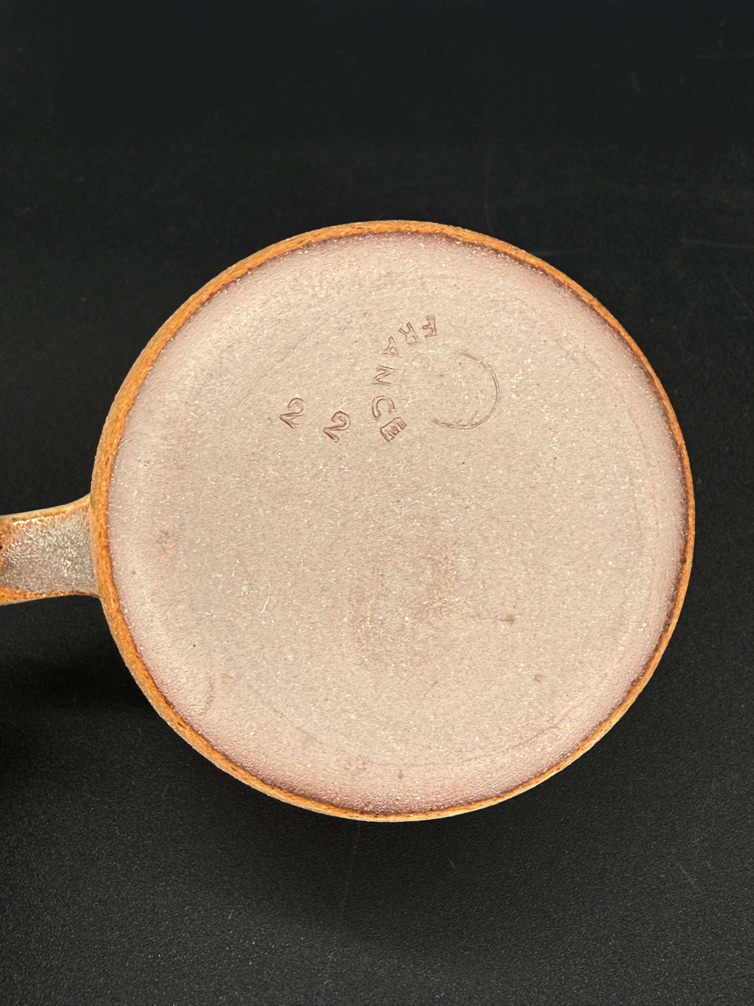 4 cups in glazed stoneware with graphic handles