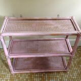 Pink rattan and cane shelf