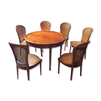 Round table with these 6 chairs in cannage