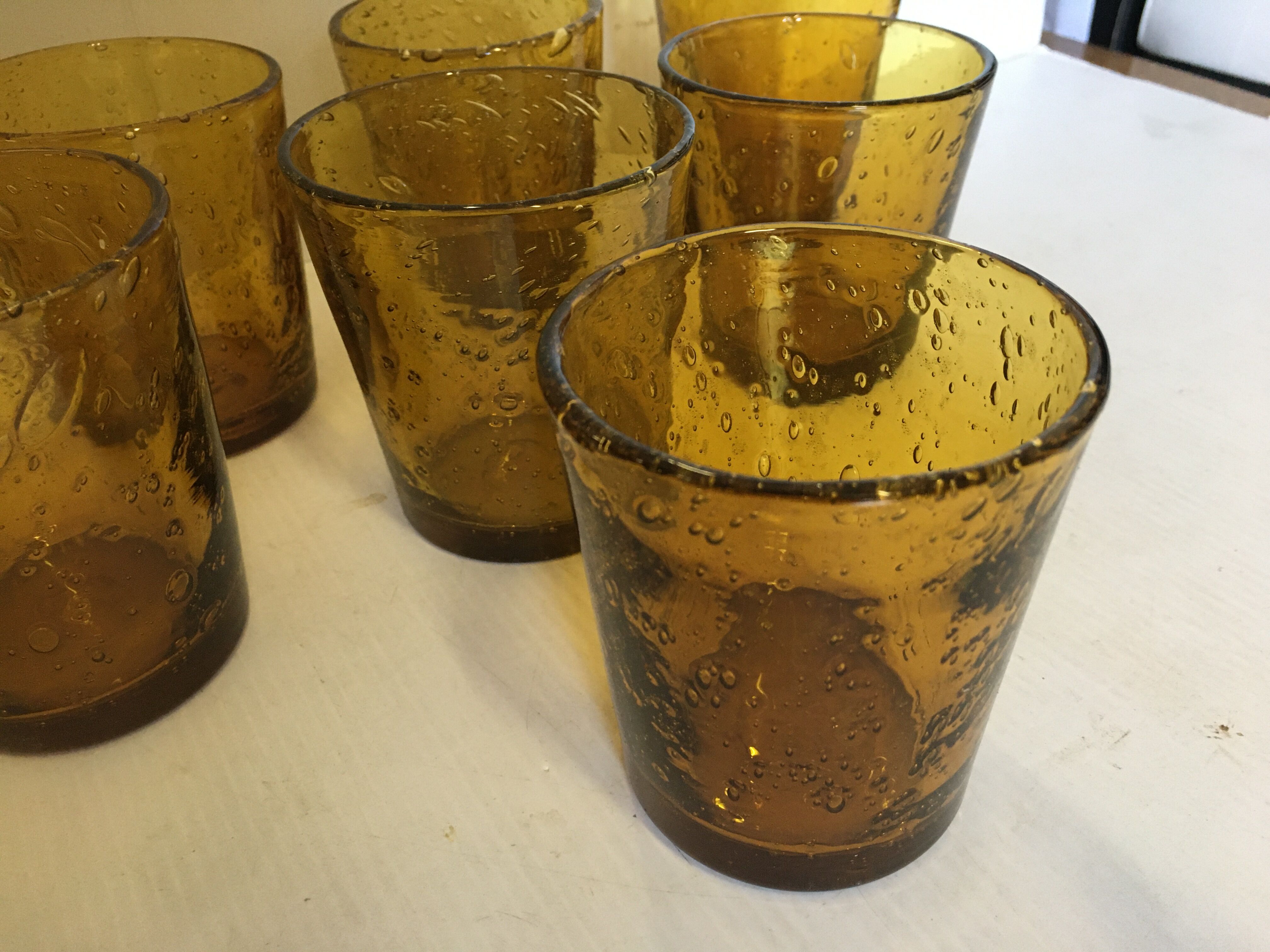 8 glasses with amber bubbled blown glass water