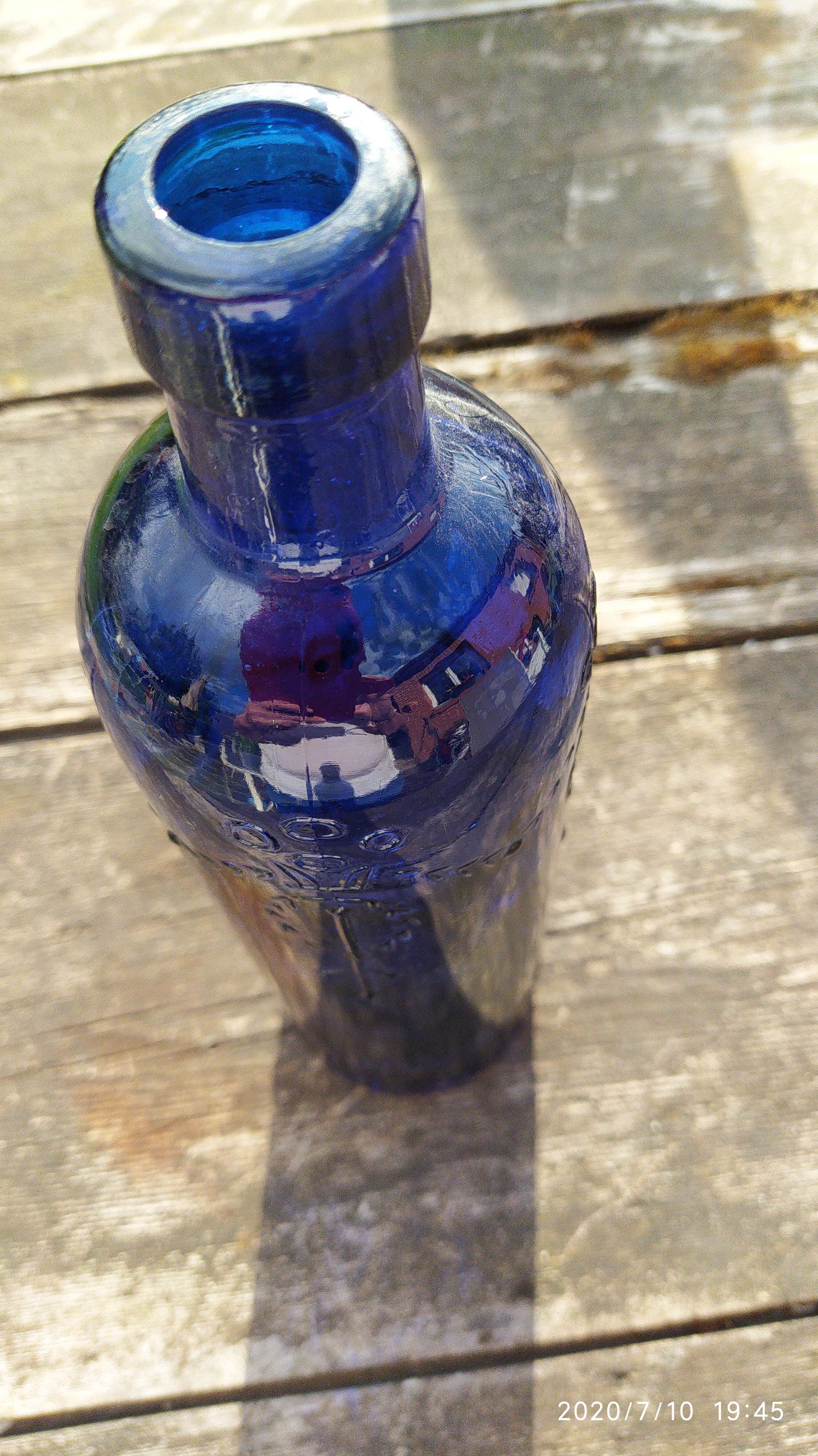 Vintage decorated glass bottle
