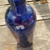 Vintage decorated glass bottle