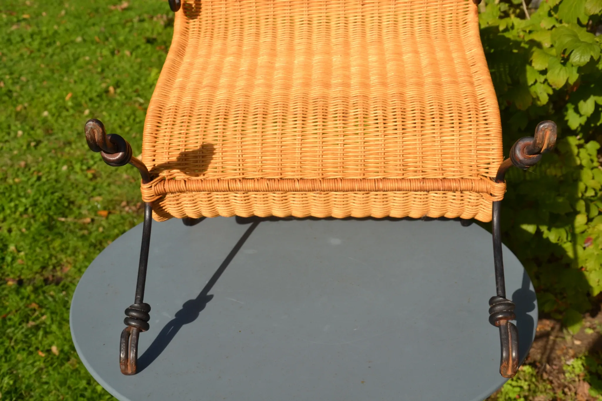 Wrought iron and rattan magazine/newspaper rack