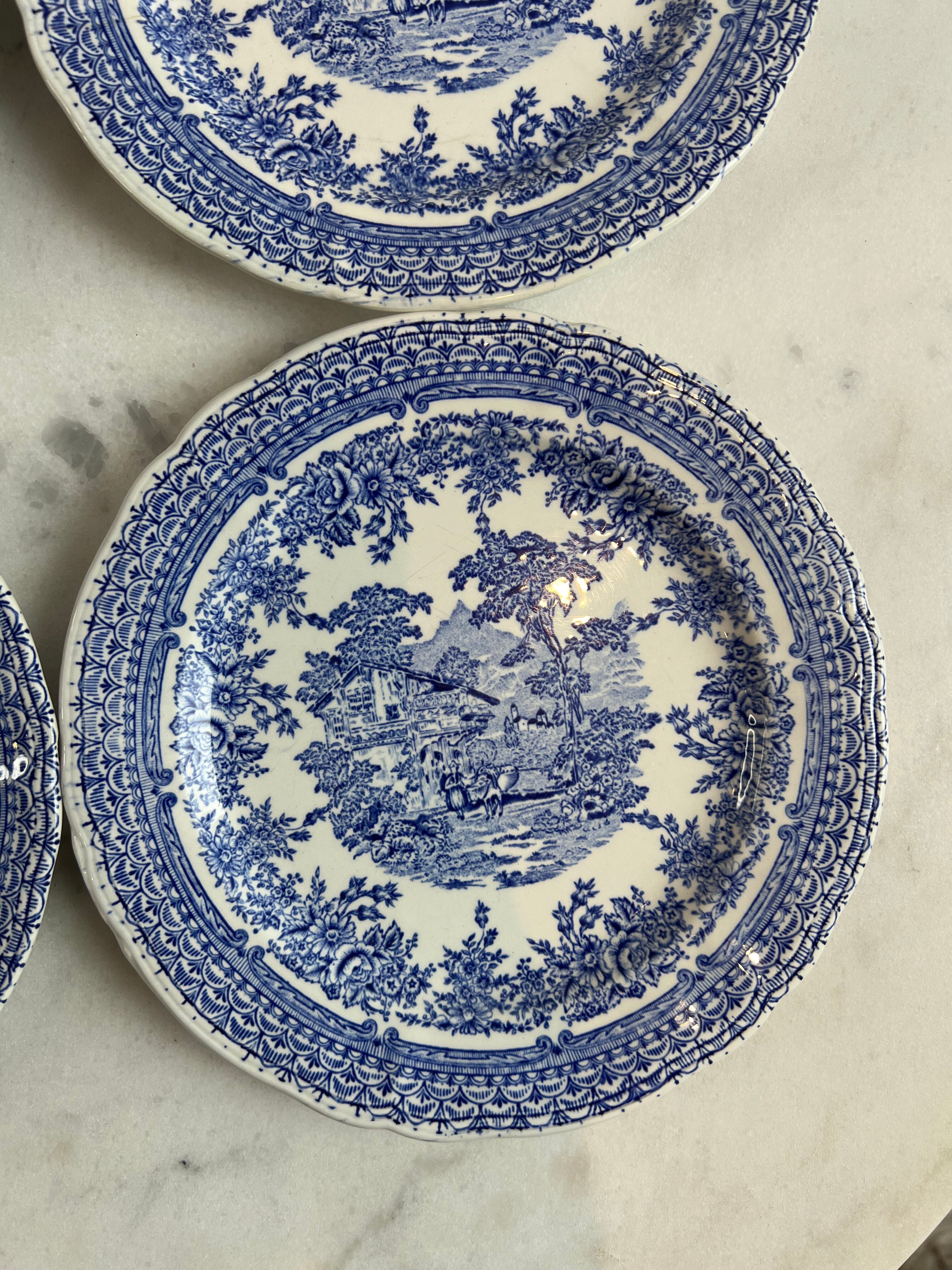 Set of four flat plates from English earthenware.