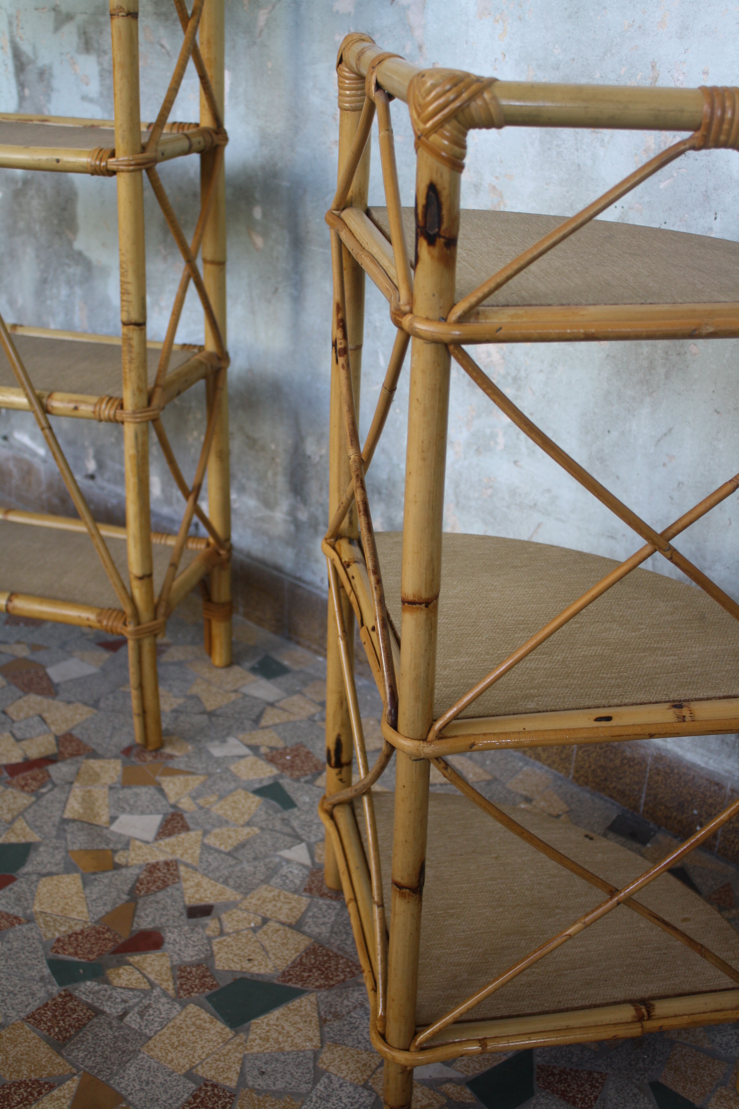 Pair of rattan shelves including a corner shelf