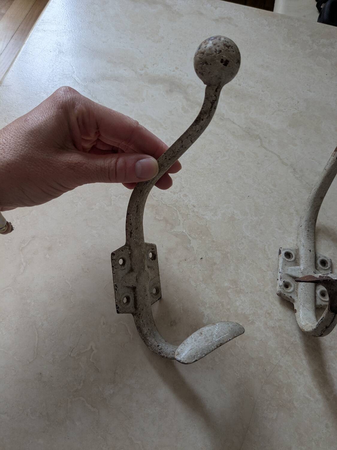 Two vintage coat hooks