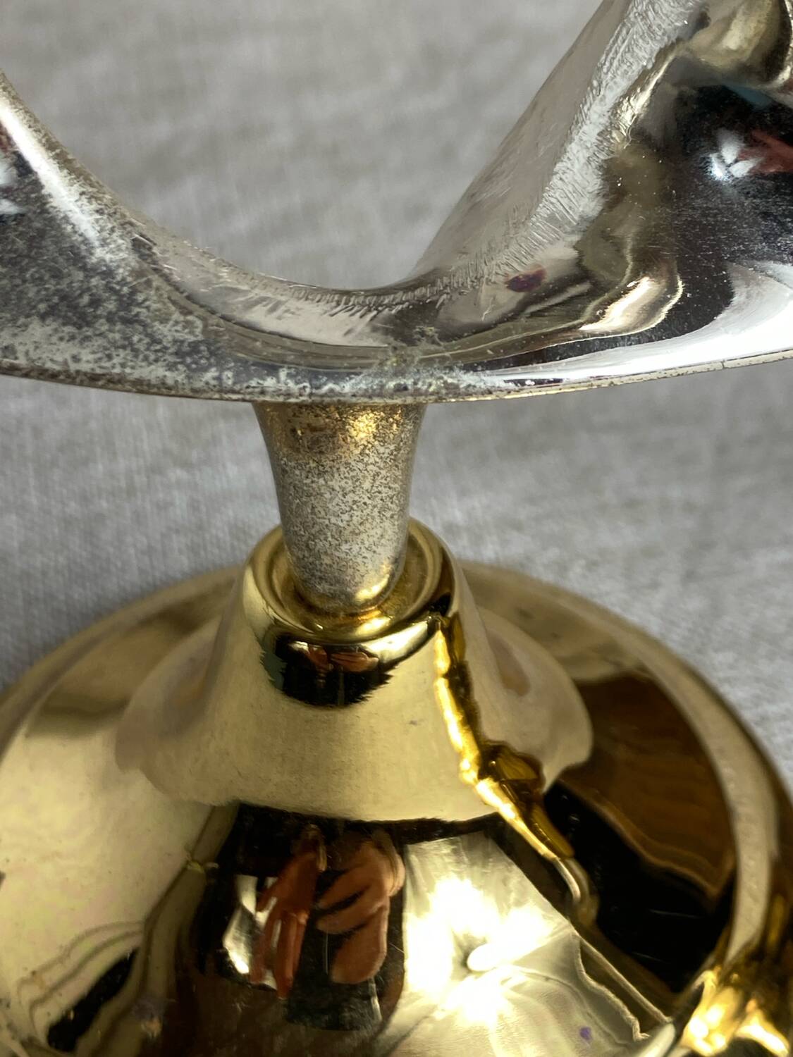Pair of silver and gold metal candlesticks