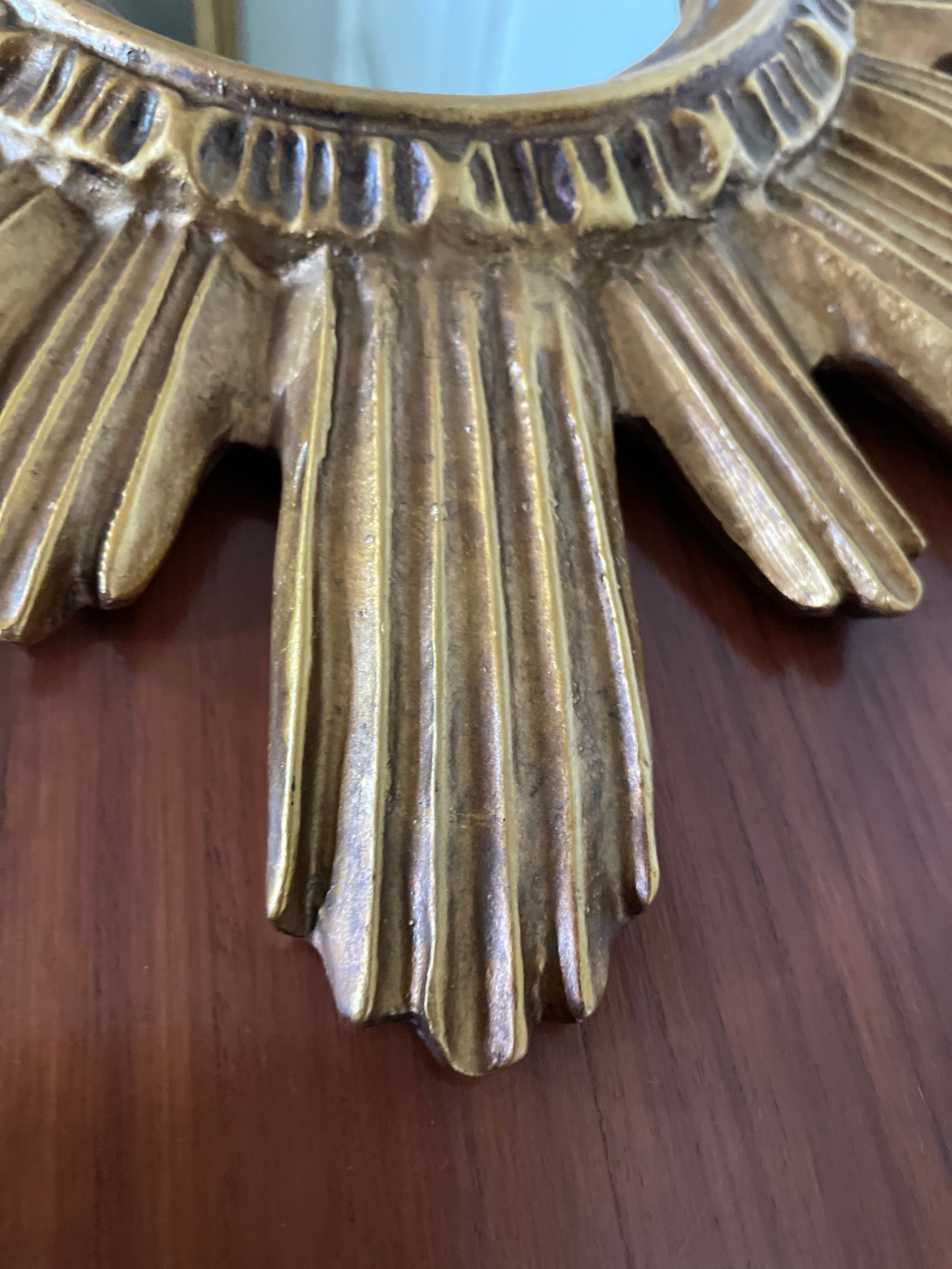 Vintage sun mirror in 60s/70s gold resin
