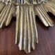 Vintage sun mirror in 60s/70s gold resin