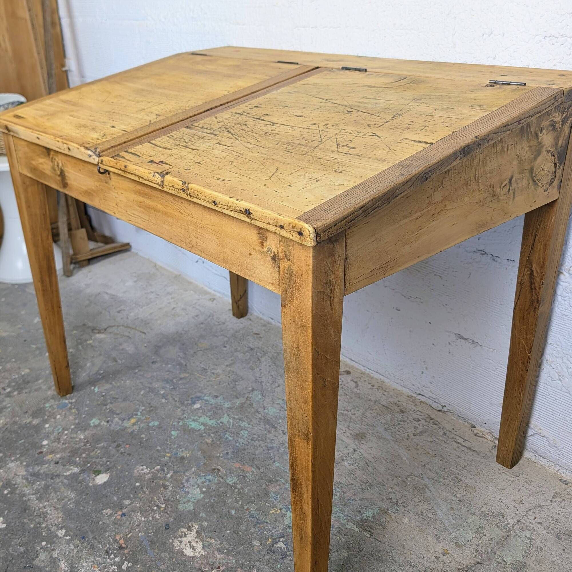 Antique wooden school desk with double lift-up tops.