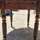 Round dining table with a drop-leaf top in solid walnut, late 19th century.