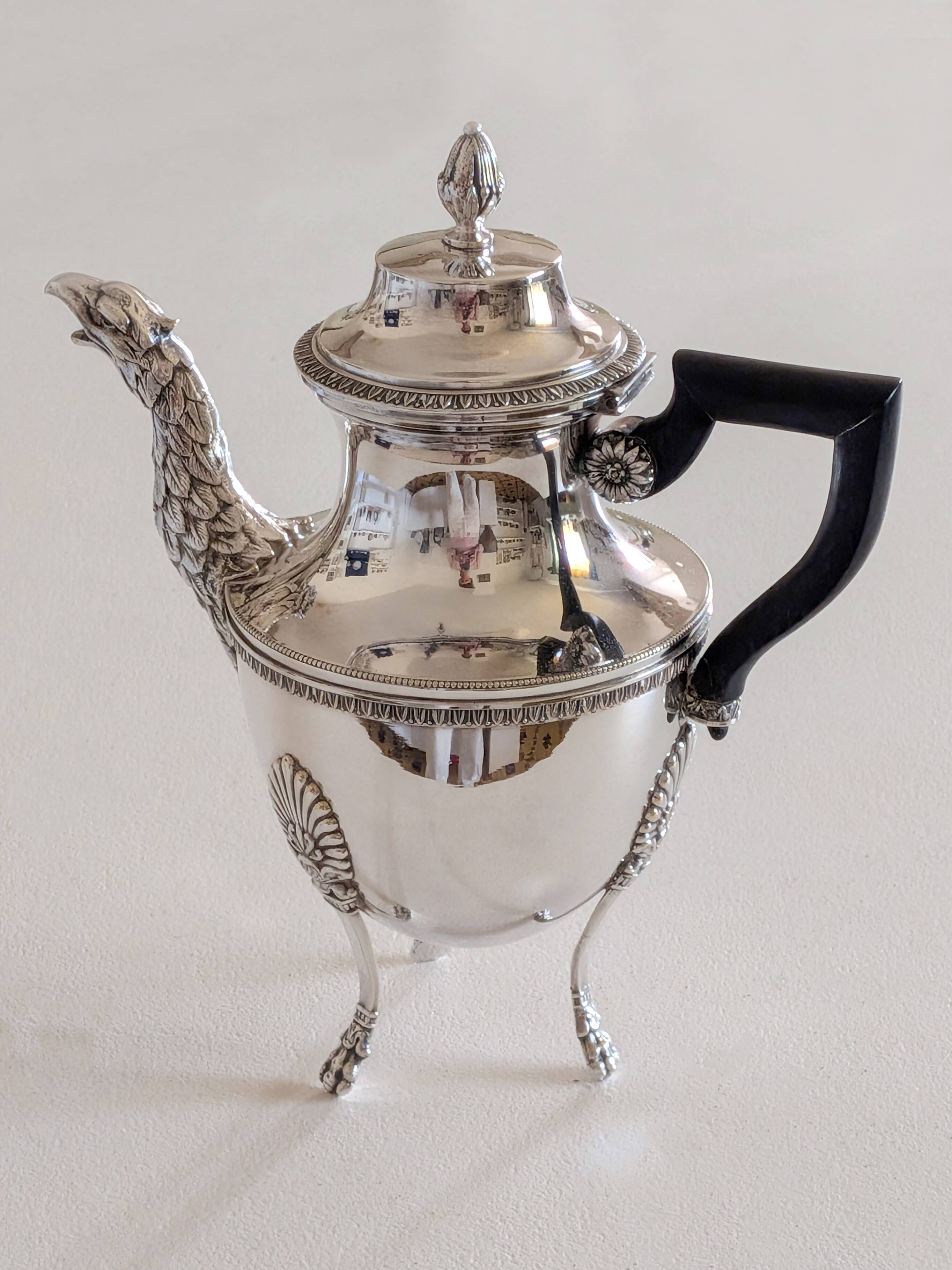 Empire-style silver-plated coffee pot with eagle head spout.