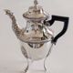 Empire-style silver-plated coffee pot with eagle head spout.