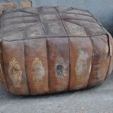 Set of 2 vintage ottomans in brown and black leather with Egyptian patterns from the 1970s.