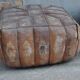 Set of 2 vintage ottomans in brown and black leather with Egyptian patterns from the 1970s.