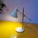 Articulated lamp in white lacquered steel and chrome, 1970.