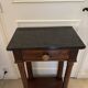 Antique small Empire console from the early 19th century in mahogany and marble.