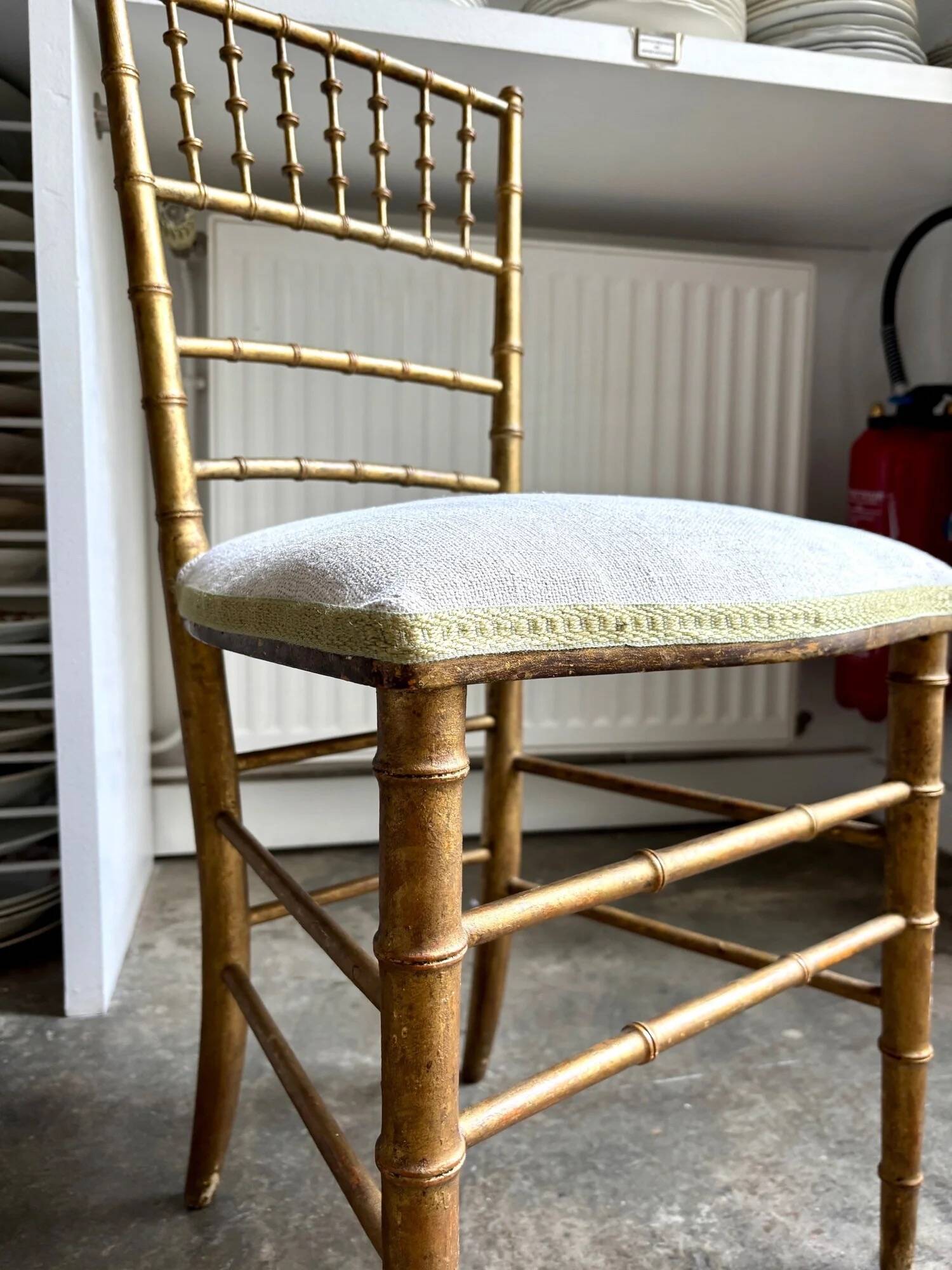 Napoleon III chair in gilded bamboo wood and beige cotton.