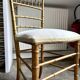 Napoleon III chair in gilded bamboo wood and beige cotton.