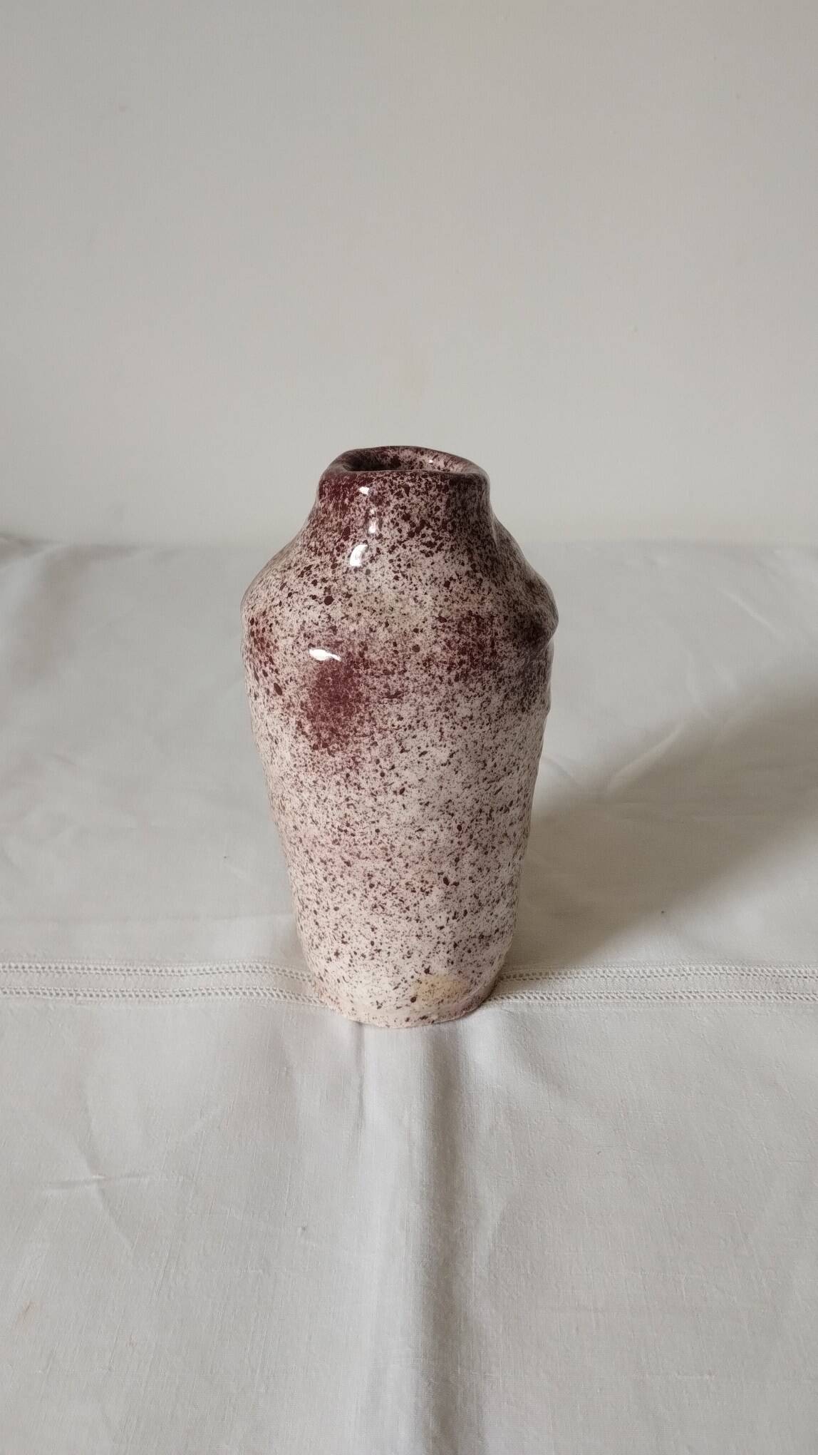 White ceramic vase with brown speckles