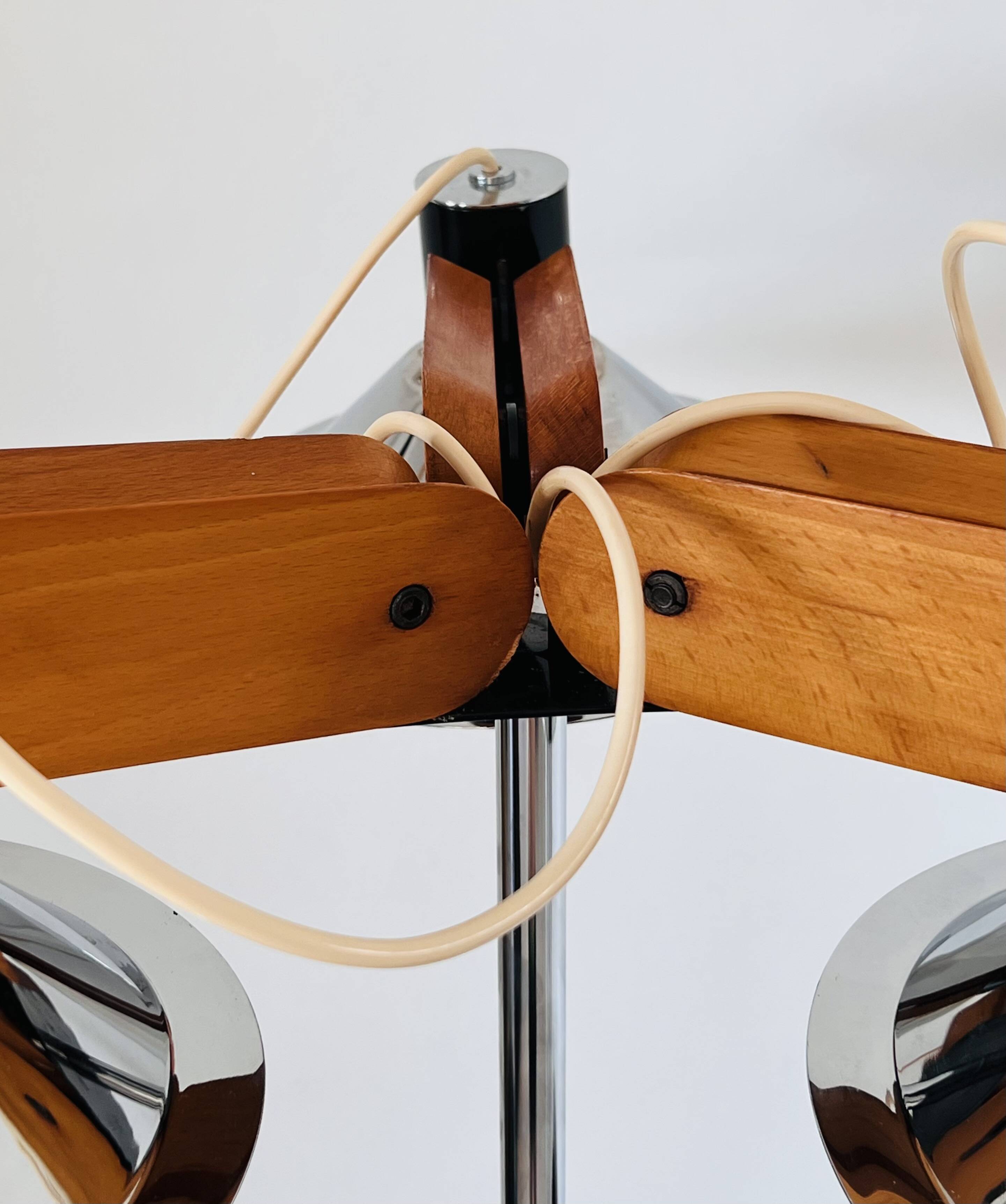 Three-light floor lamp in wood and chrome metal, Spain 1970s.