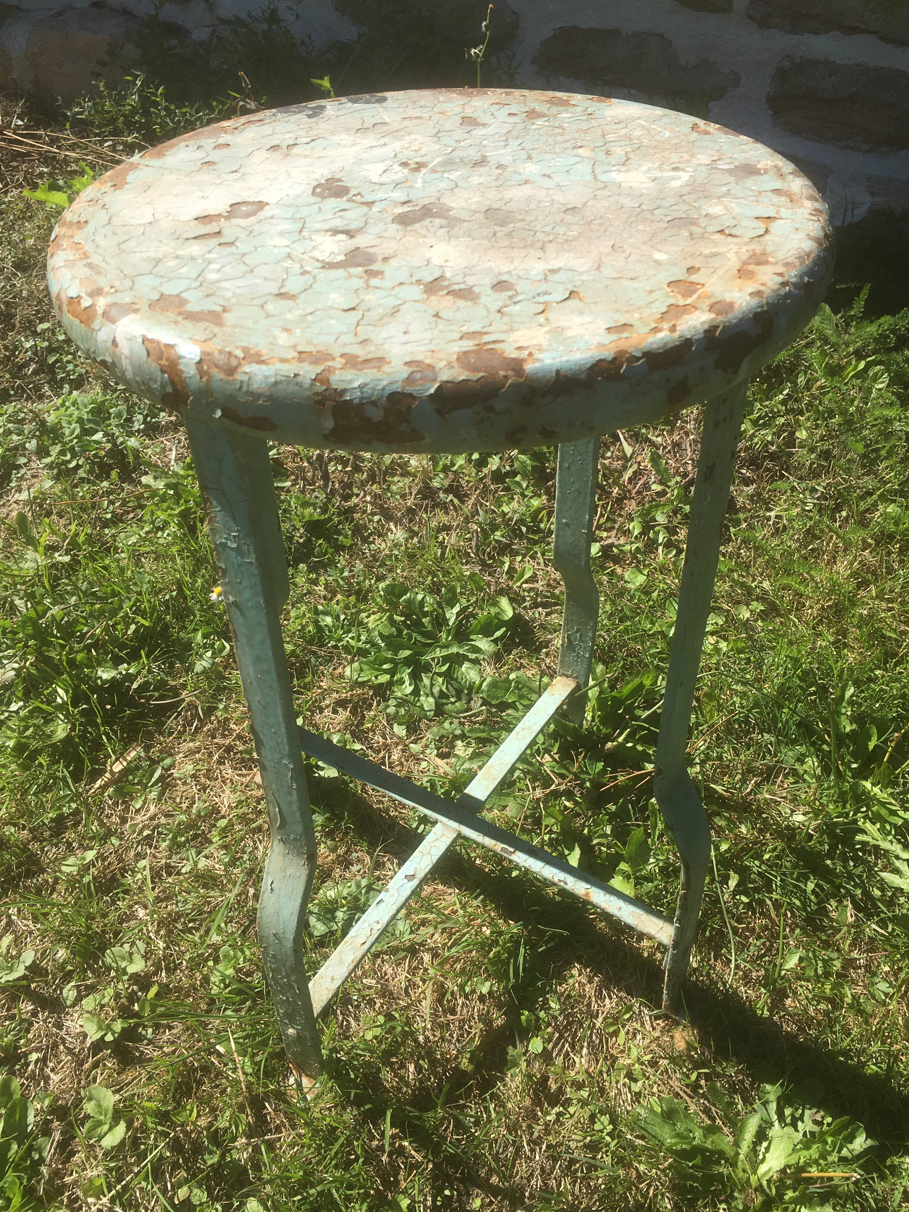 Patinated metal industrial stool