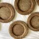 Set of round woven rattan and canework coasters