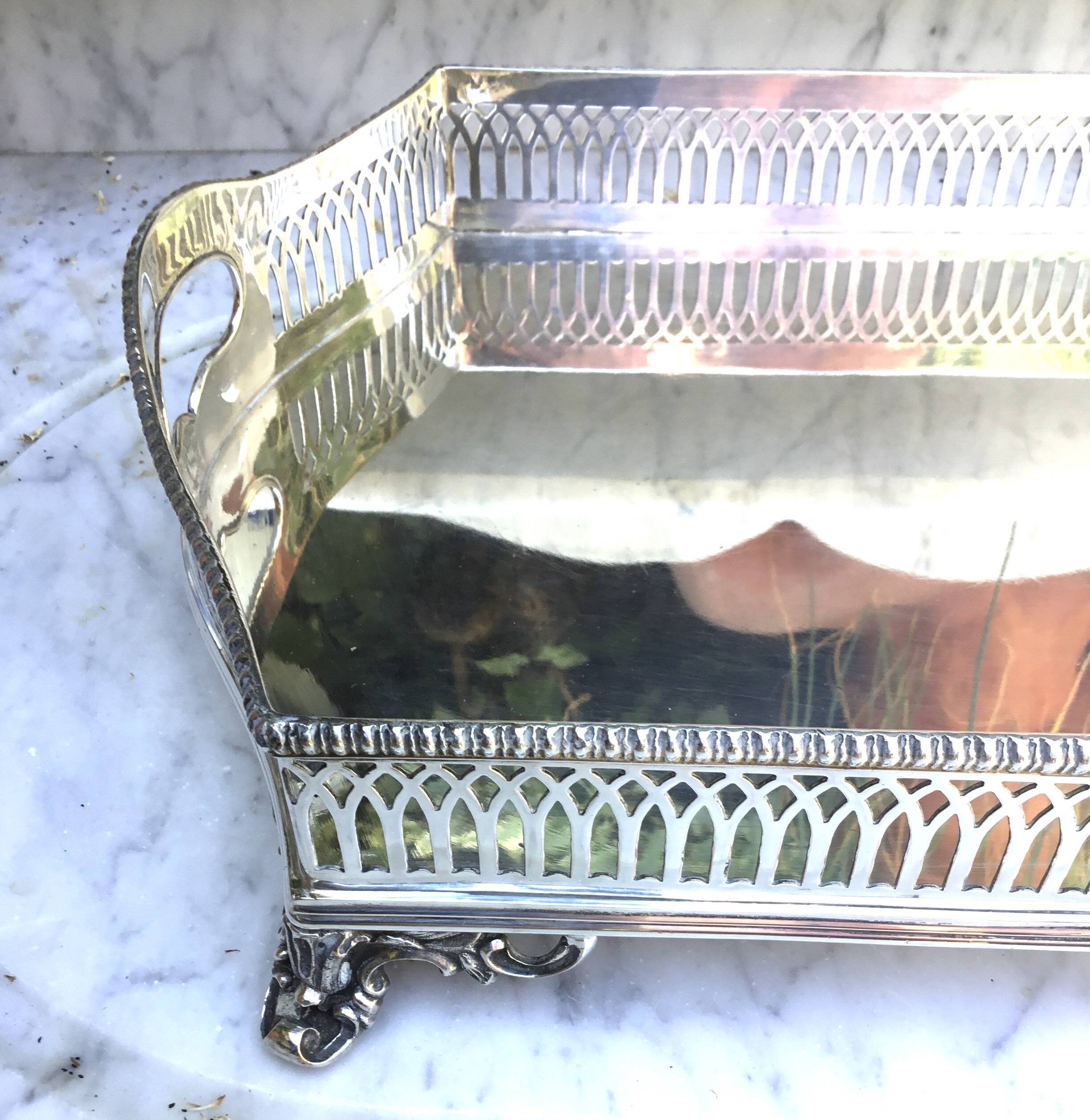 Important silver-plated metal table in the Louis XVI style.