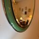 Vintage oval mirror with English green lacquered curved frame and chrome surround