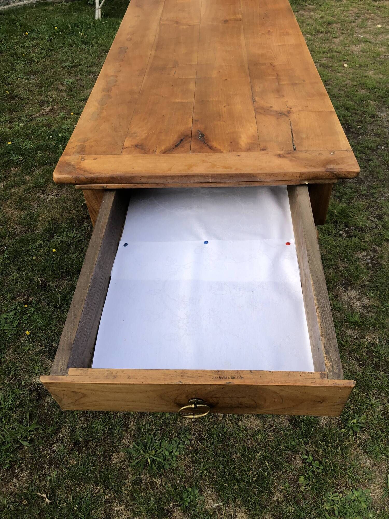 Antique farmhouse table in solid cherry wood with 2 drawers and 1 pull-out at the end with turned legs.
