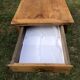 Antique farmhouse table in solid cherry wood with 2 drawers and 1 pull-out at the end with turned legs.