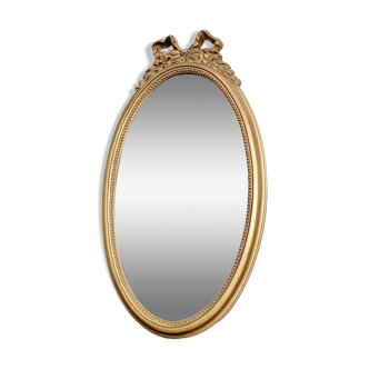 Golden oval mirror