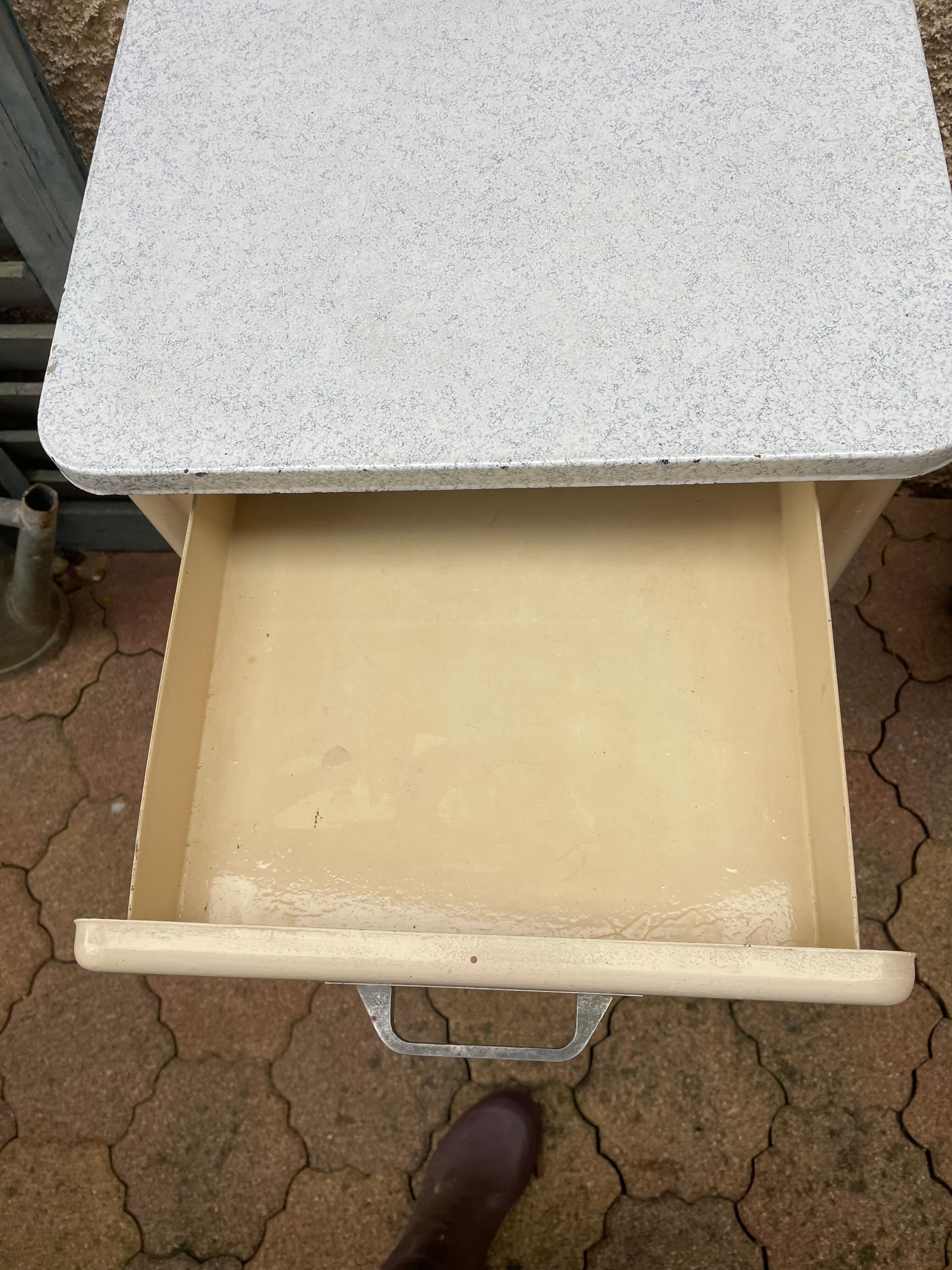 Furniture stored bottle in enamelled sheet metal