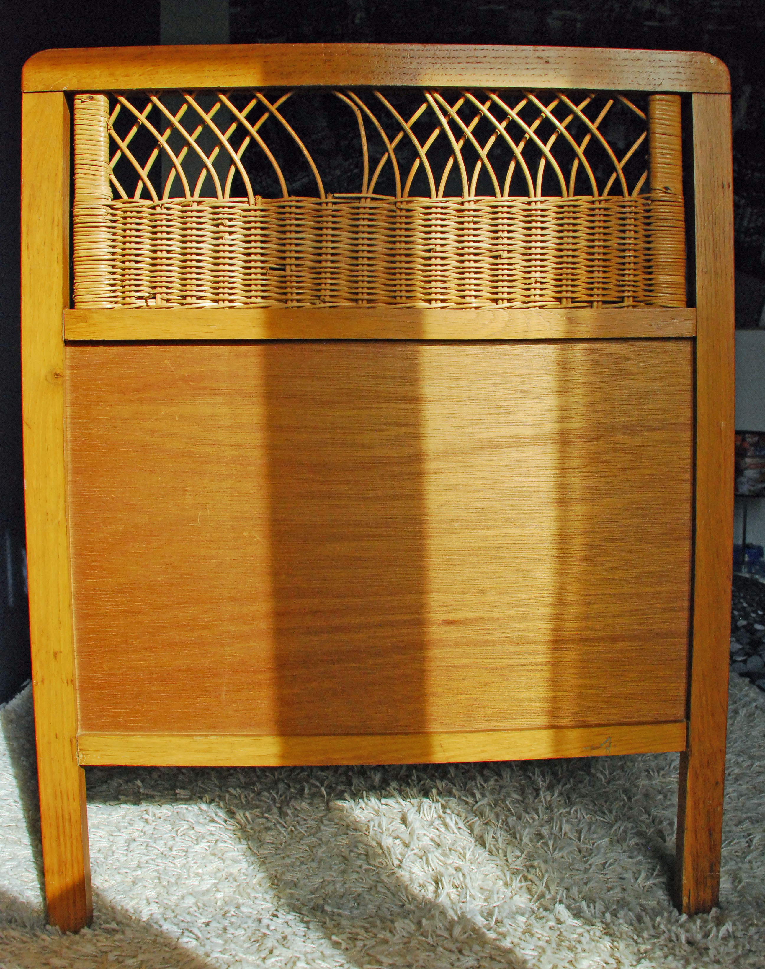 Wooden bed and vintage rattan
