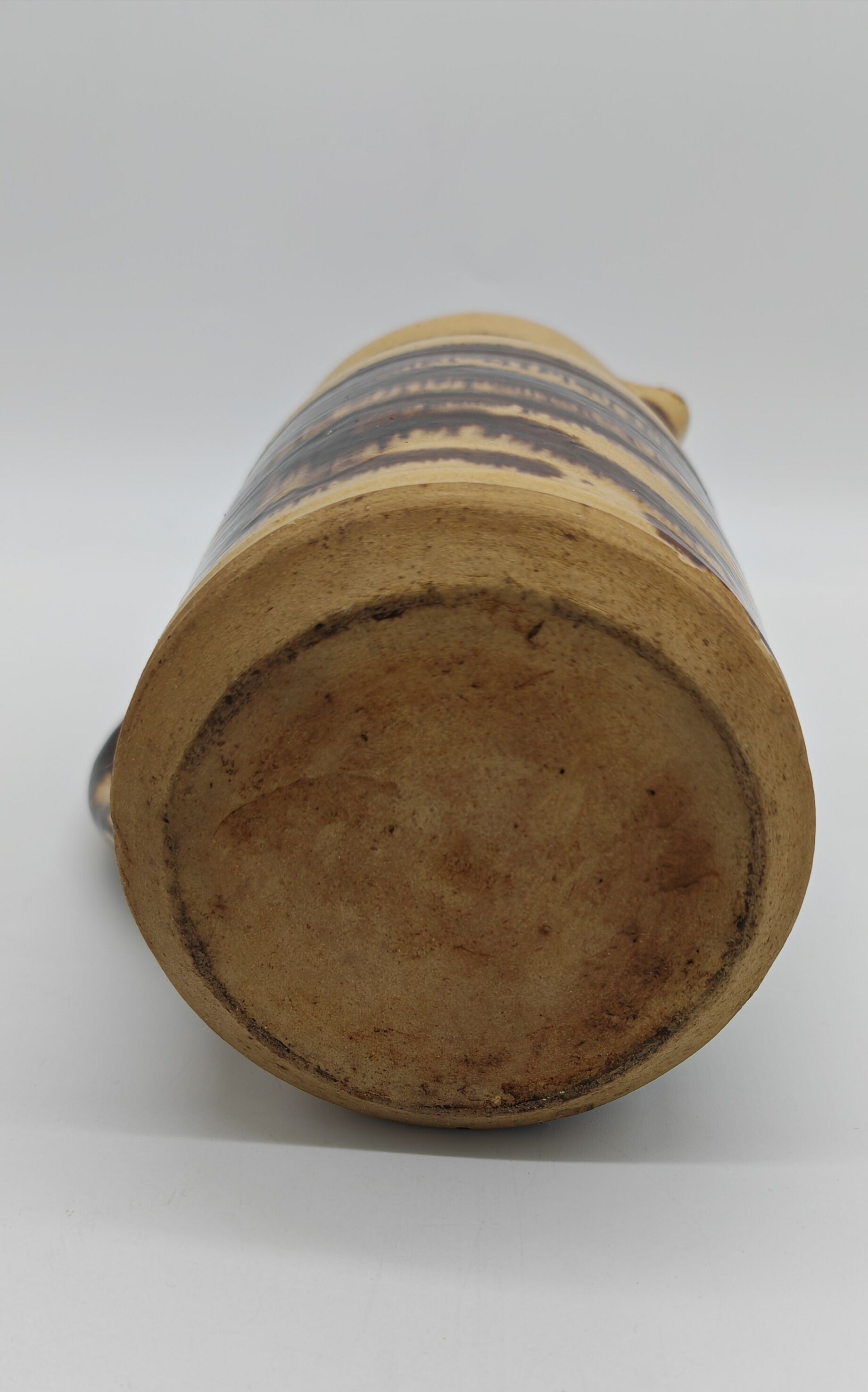 Pitcher covered in glazed earth old french tabby dishes