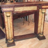 19th century wooden fireplace, faux marble paint. Can act as a console.