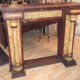 19th century wooden fireplace, faux marble paint. Can act as a console.