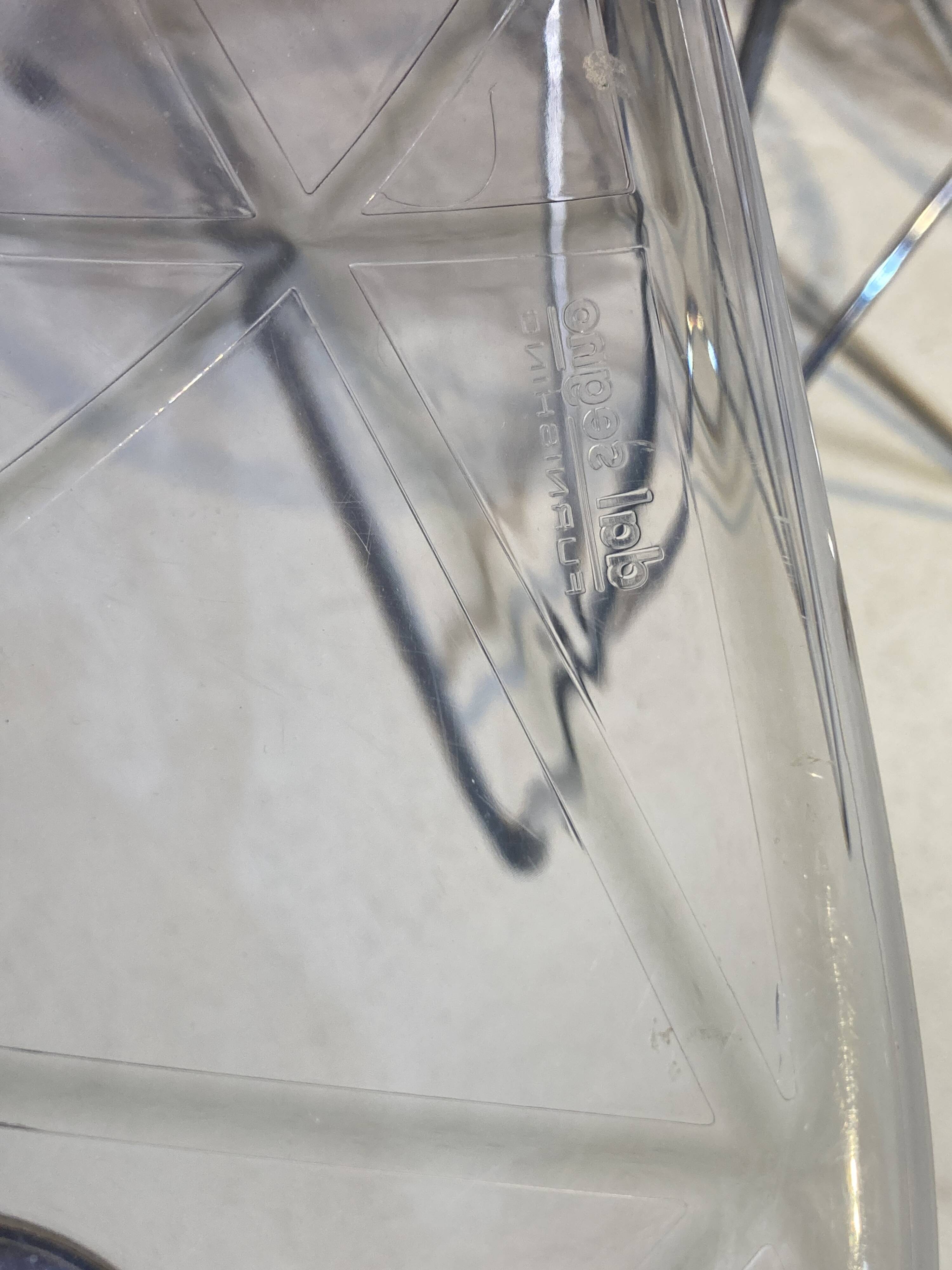 Set of four plexiglass and metal chairs