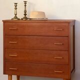 Vintage 1960s chest of drawers with covered handles.