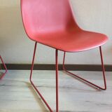 Red muuto "visu" chairs with sled base