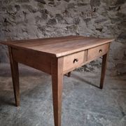 French antique dining table in cherry wood with two drawers, circa 1880–1920.