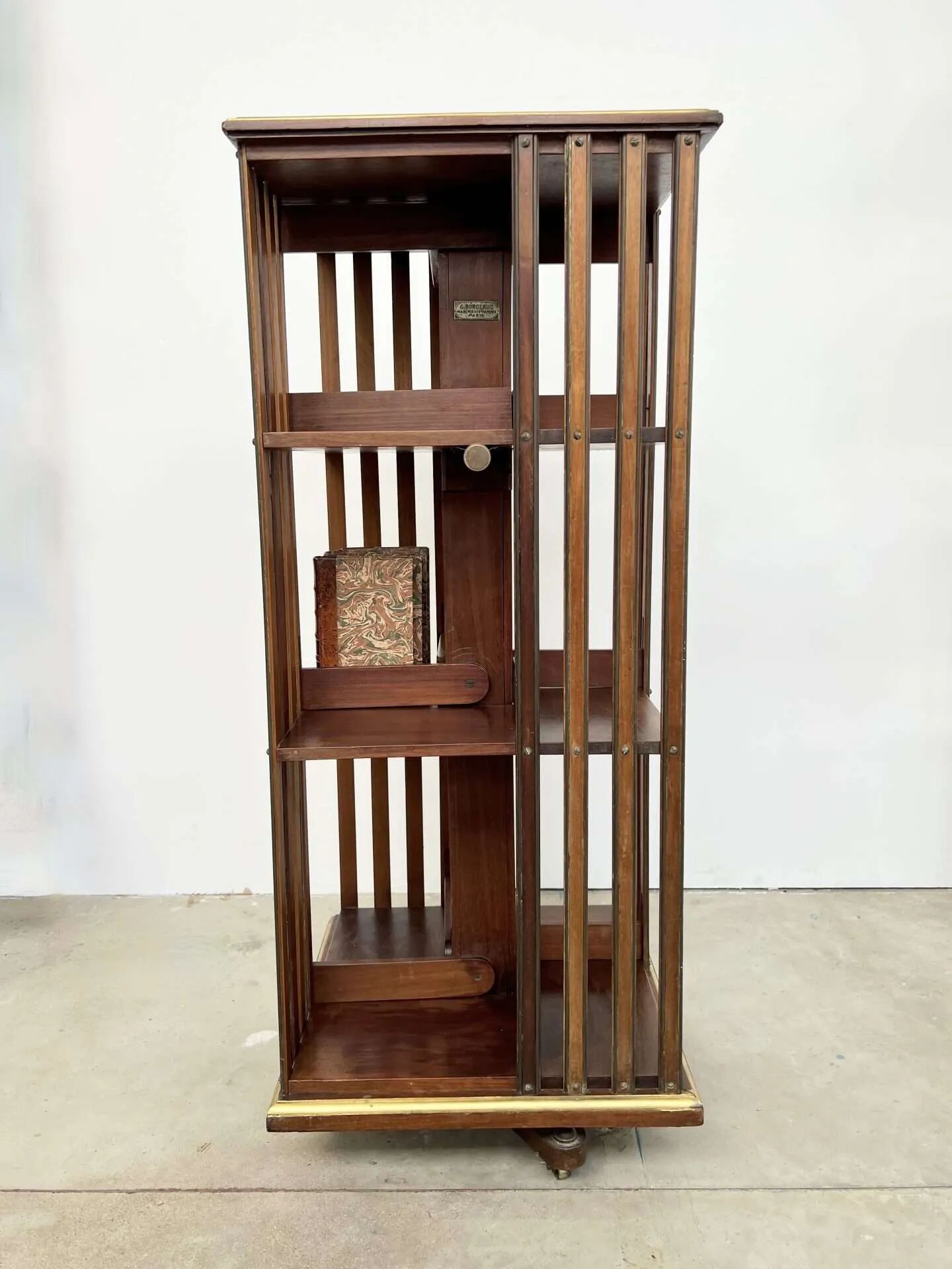 Rotating mahogany and brass library — G. Borgeaud, circa 1900