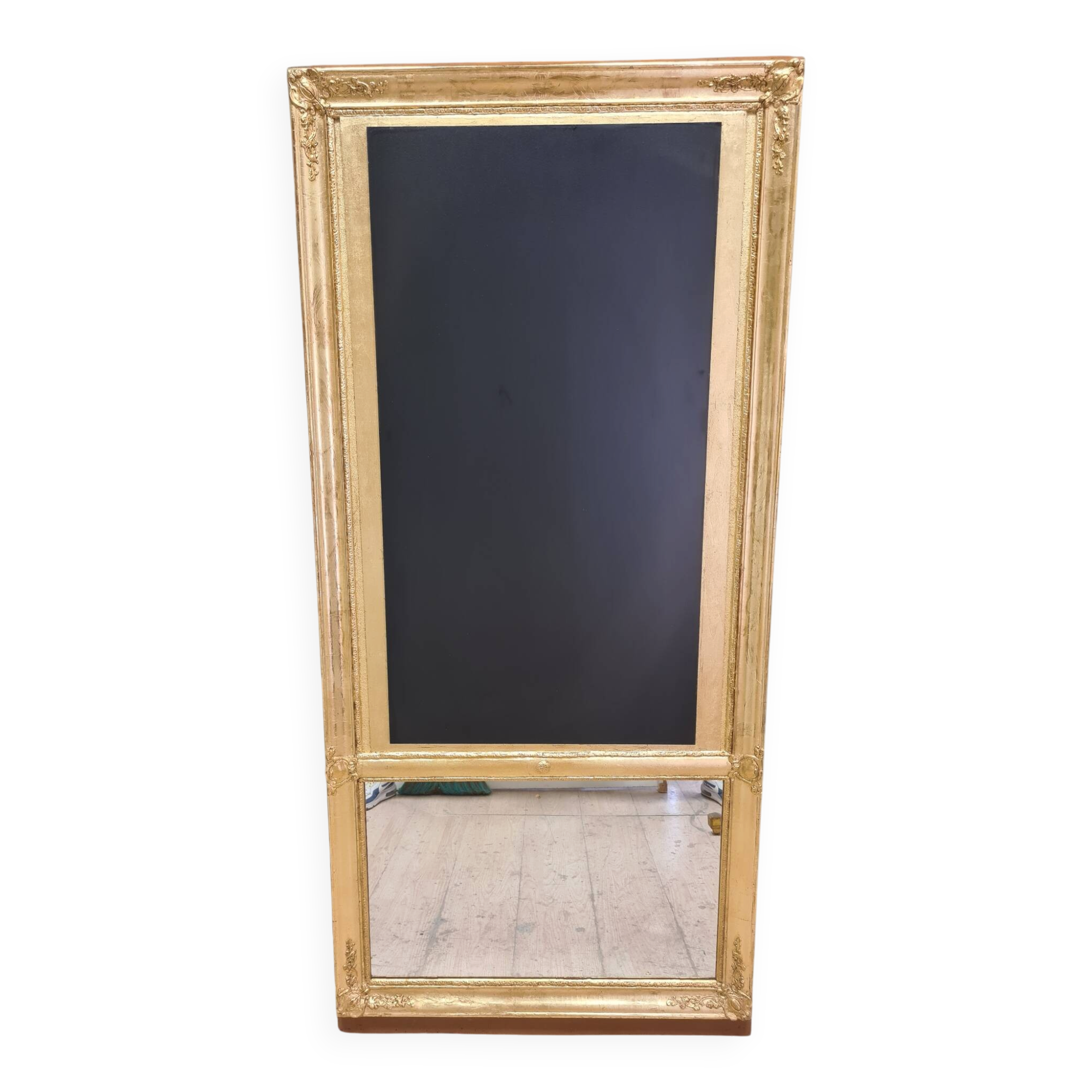19th-century gilded trumeau mirror with restaurant slate.