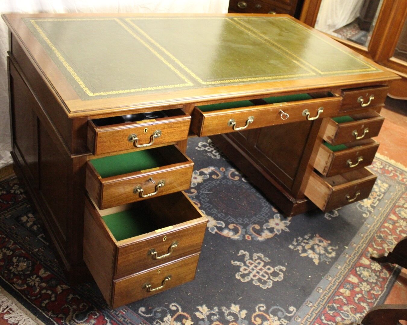 Solid mahogany pedestal desk with green leather inset ,