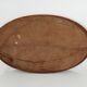 Antique oval mirror with beveled glass in wood and stucco, 19th century