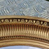 Antique oval mirror in gilded stucco with gold leaf, 19th century