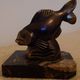 Art Deco pair of bookends with stylised fish in patinated metal and marble.
