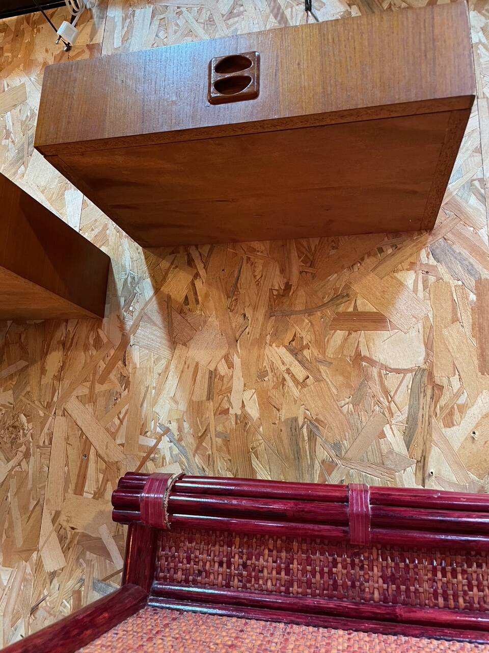 Suspended teak bedside tables in vintage 1960s Scandinavian style.