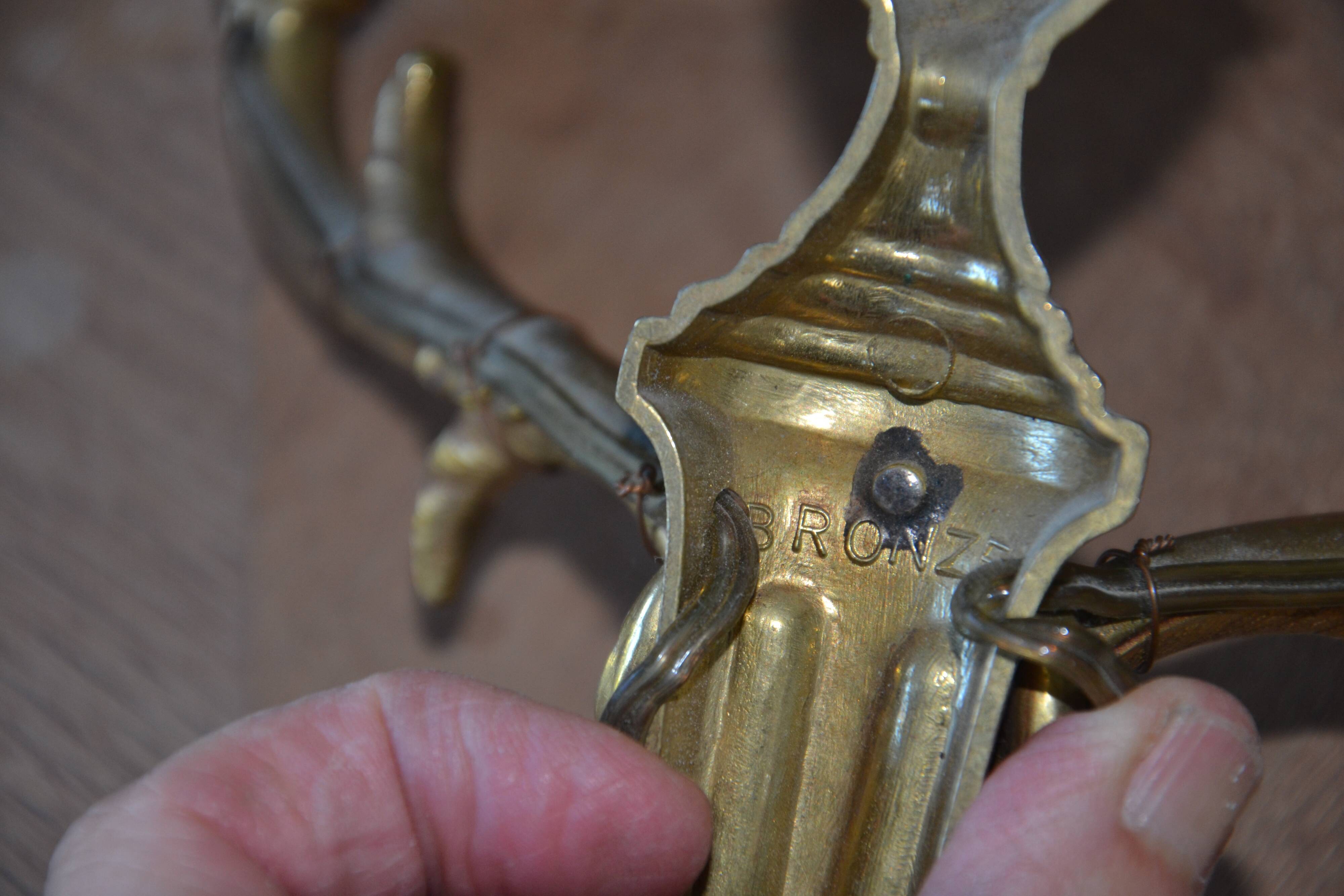 2 sculpted bronze wall lights